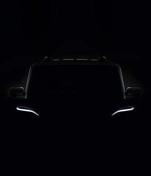 Black Mahindra Scorpio SUV Front View with Glowing LED Headlights in Darkness HD phone wallpaper