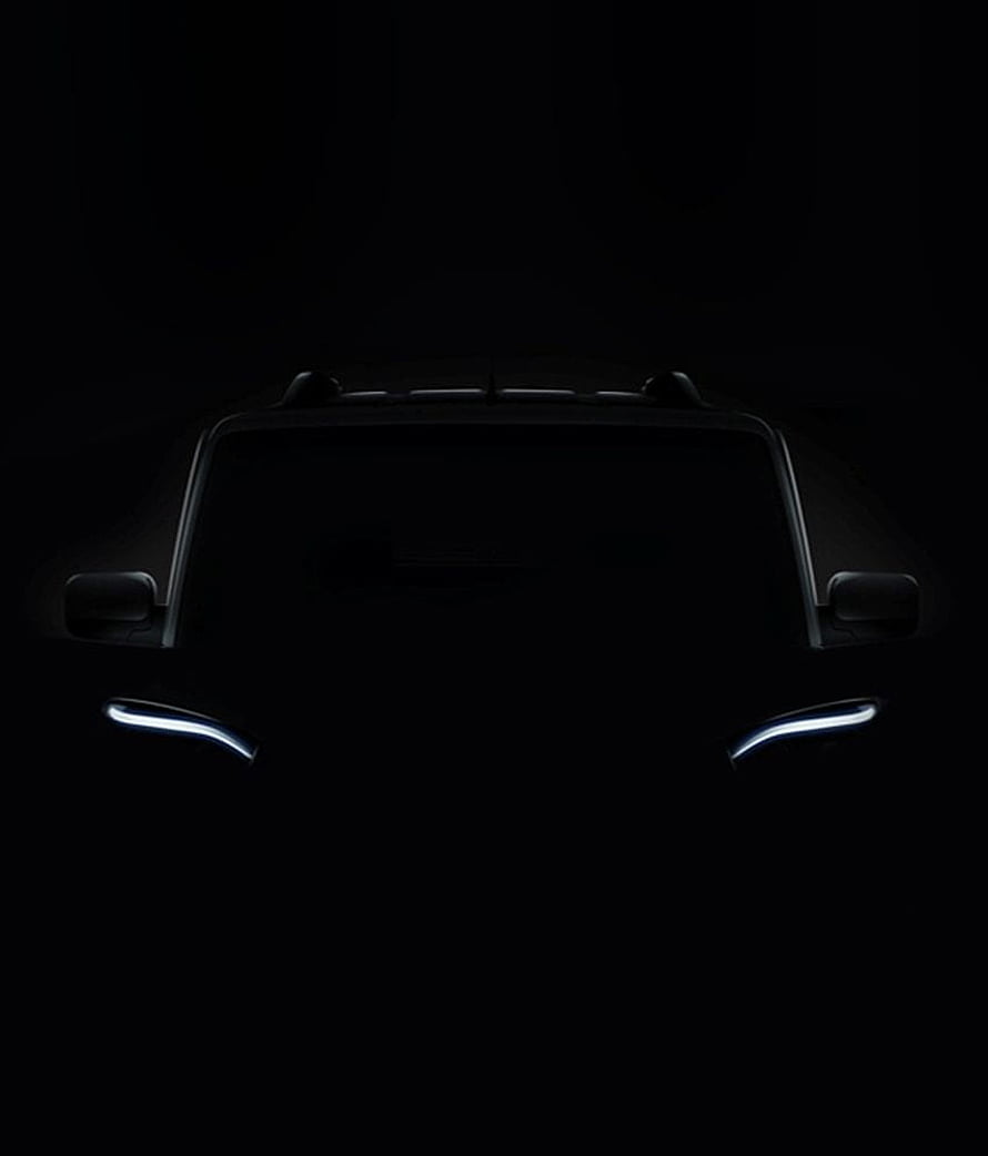 Black Mahindra Scorpio SUV Front View with Glowing LED Headlights in Darkness HD phone wallpaper