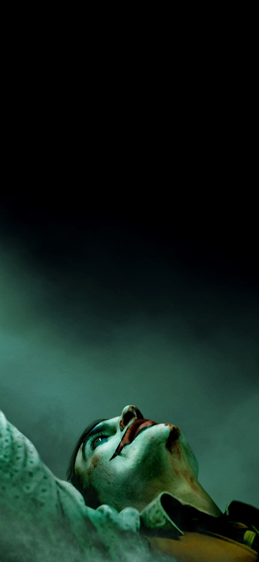 Joker Movie Character Looking Up in Dark Moody Atmosphere HD phone wallpaper