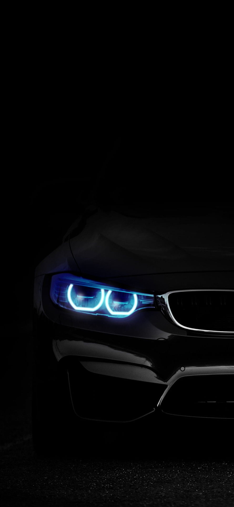 BMW M3 Front Headlight Close-Up with Blue Angel Eyes on Black Background HD phone wallpaper