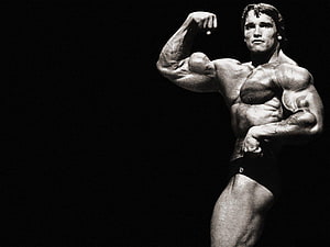 Arnold Schwarzenegger Classic Bodybuilding Pose in Black and White HD wallpaper