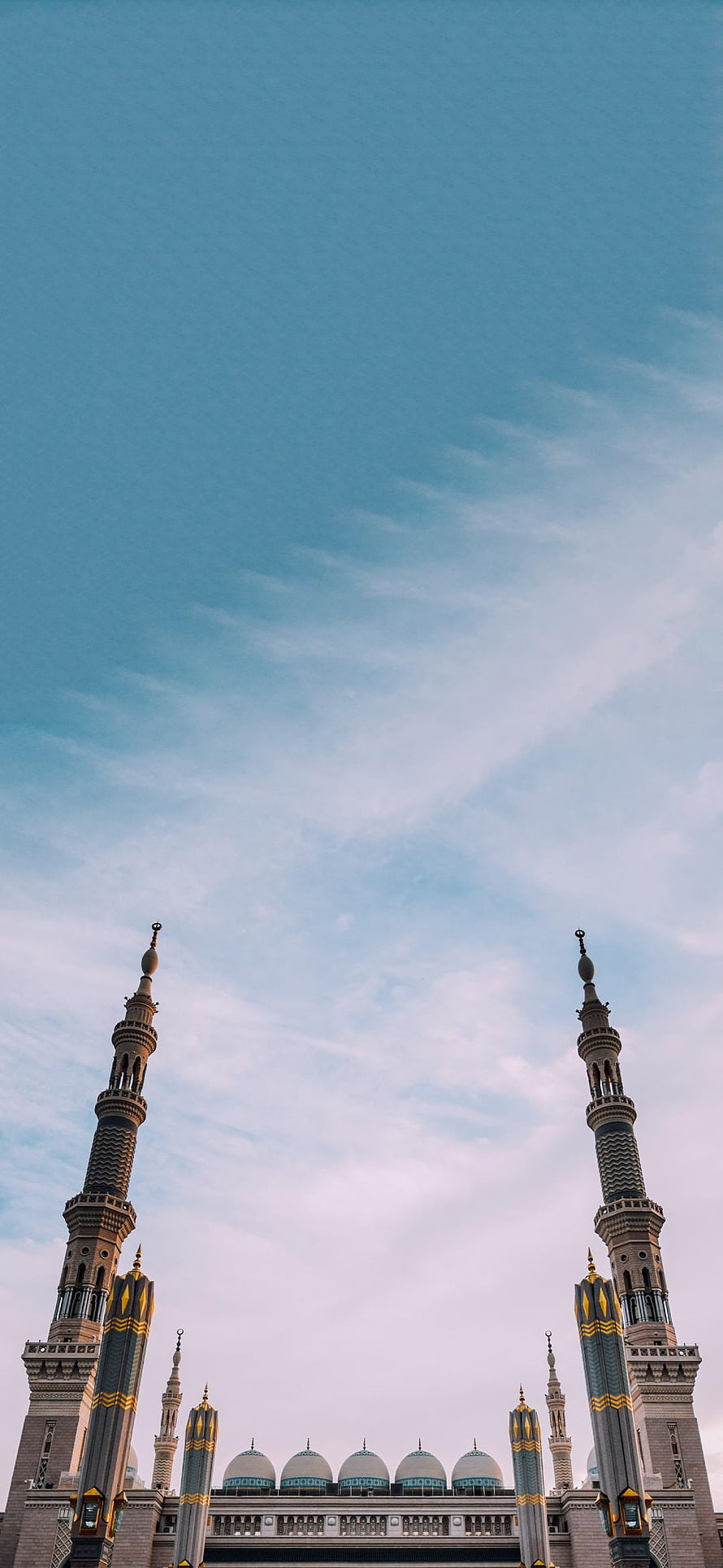 Masjid Nabawi Minarets and Domes Against a Soft Blue Sky HD phone wallpaper