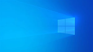 Windows 10 Default Blue Gradient Desktop Background with Glowing Window Logo HD wallpaper