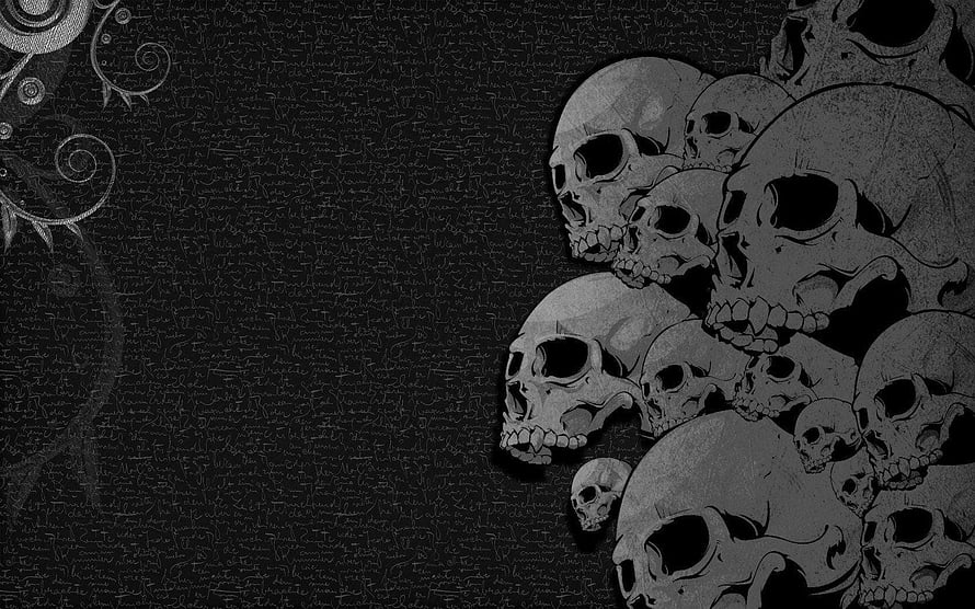 Dark Gothic Skull Cluster with Ornamental Flourishes on Textured Black Background HD wallpaper