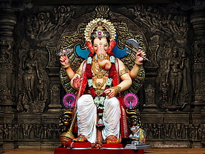 Lalbaugcha Raja Ganapati Statue Adorned With Garlands And Traditional Temple Decor HD wallpaper