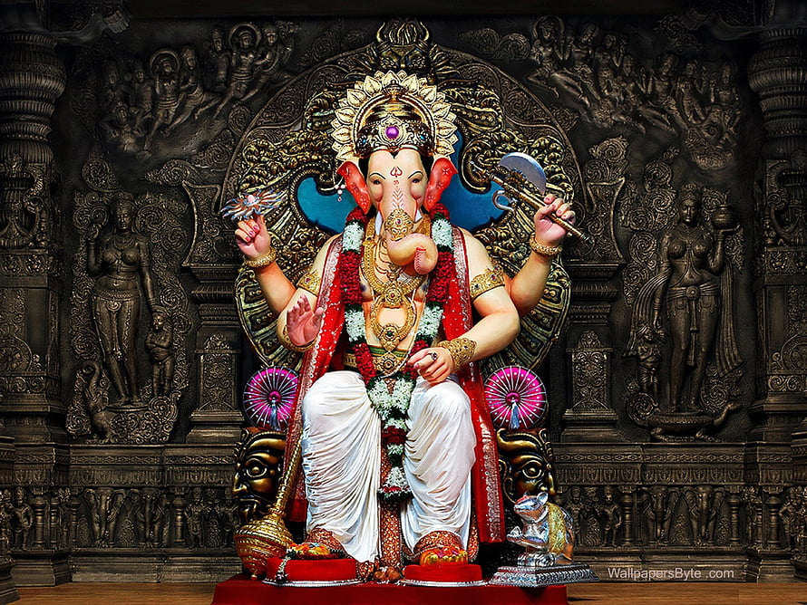 Lalbaugcha Raja Ganapati Statue Adorned With Garlands And Traditional Temple Decor HD wallpaper