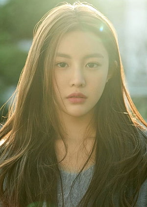 Go Yoon Jung Soft Backlit Portrait with Long Wavy Hair and Gentle Expression HD phone wallpaper
