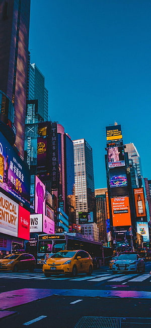 Vibrant Times Square New York City Night Scene with Neon Billboards and Yellow Taxis HD phone wallpaper