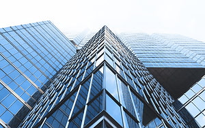 Modern Glass Skyscraper Architecture Looking Up at Corporate Office Tower Facade HD wallpaper