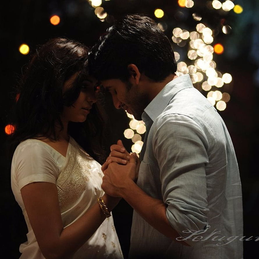Romantic Couple Holding Hands Under Warm Bokeh Lights at Night HD phone wallpaper