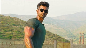 Hrithik Roshan in War Movie Action Scene with Sunglasses and Mountain Backdrop HD wallpaper