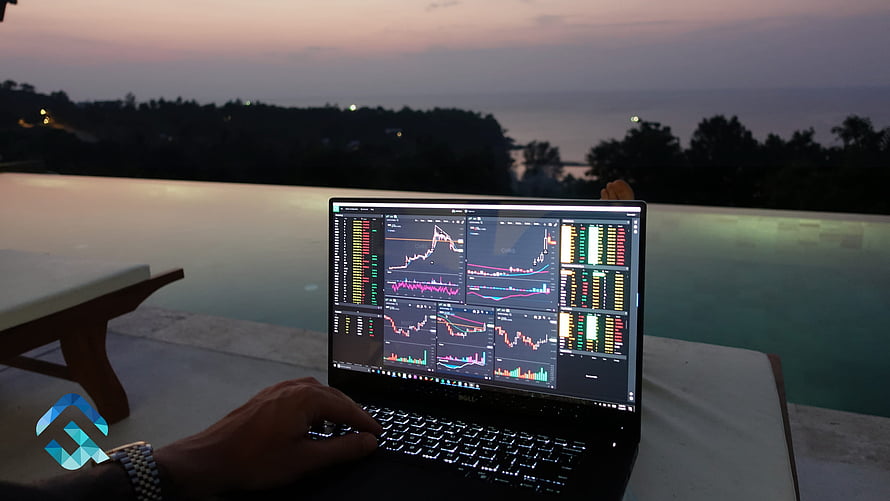 Laptop displaying stock market charts and trading data by an infinity pool at dusk HD wallpaper