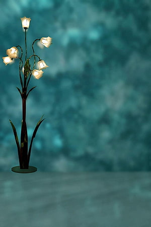 Elegant Floral Table Lamp with Bell-Shade Lights Against a Soft Teal Studio Backdrop HD phone wallpaper