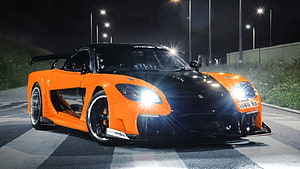 Veilside Mazda RX-7 Widebody Supercar in Orange and Black at Night HD wallpaper