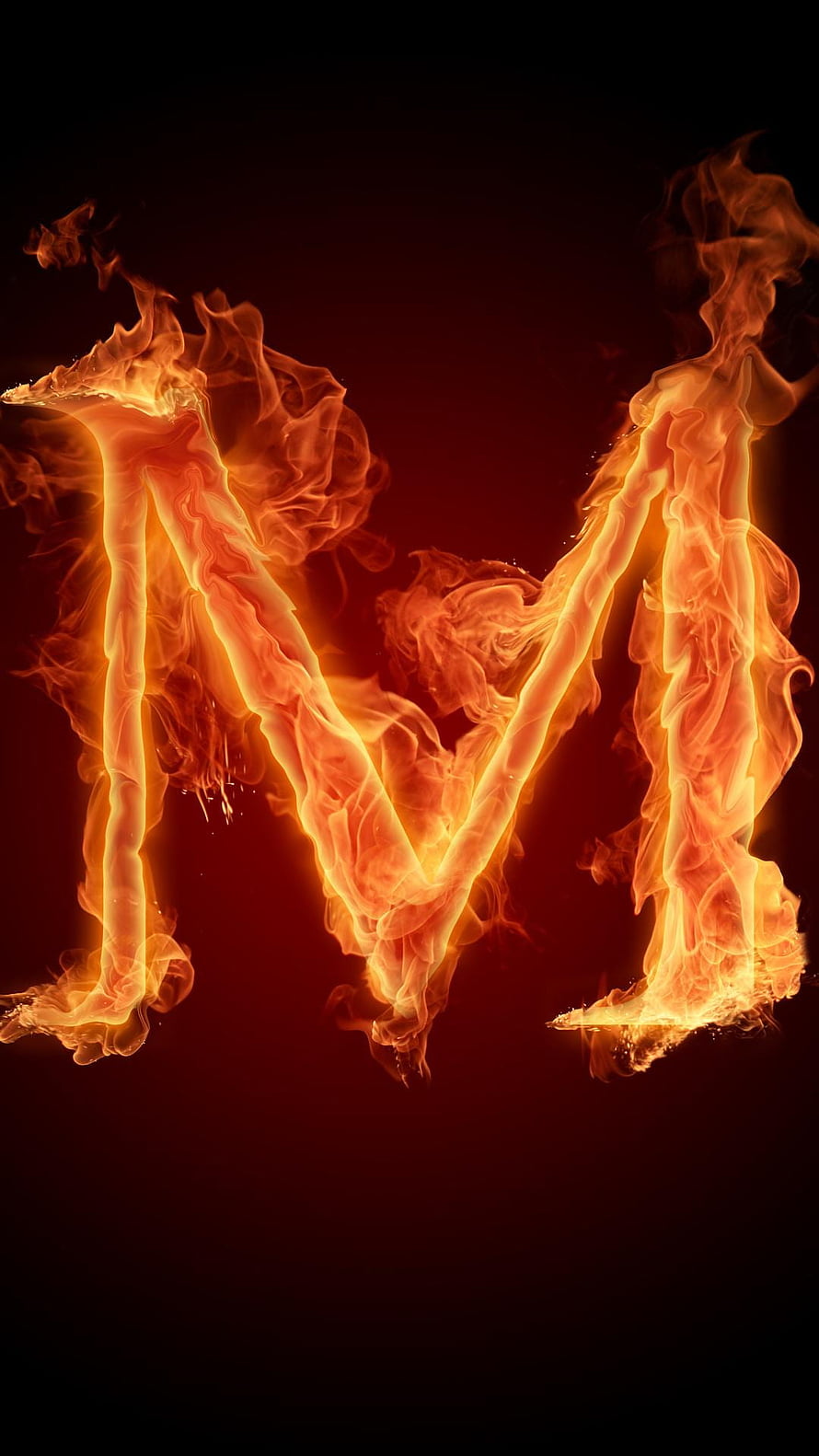 Burning Letter M in Vivid Orange Flames on a Dark Background HD phone wallpaper