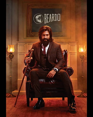 Yash in Beardo promotional portrait seated in a vintage leather armchair with a walking cane HD phone wallpaper