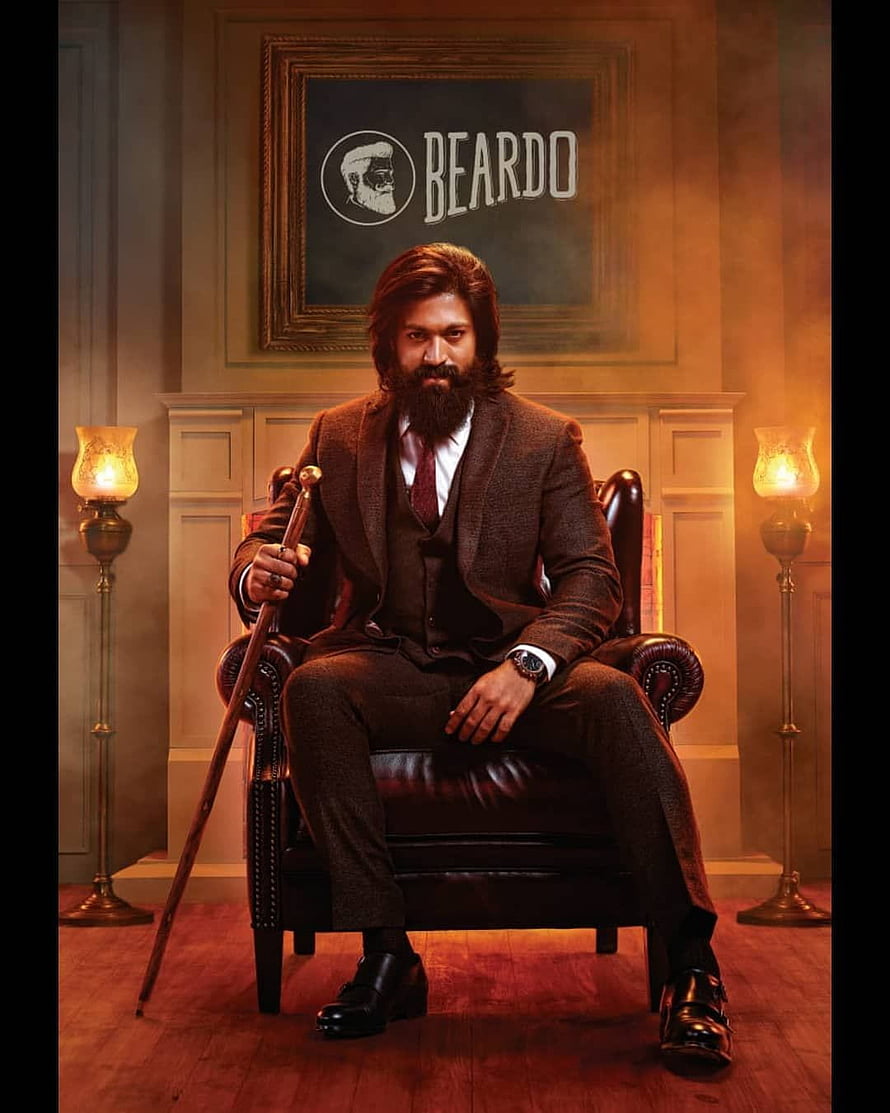 Yash in Beardo promotional portrait seated in a vintage leather armchair with a walking cane HD phone wallpaper