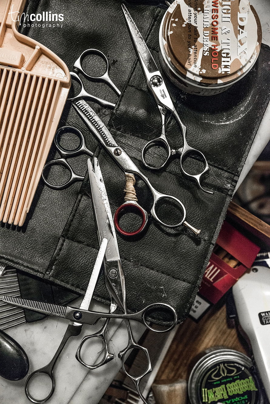 Vintage Barbershop Tools and Scissors on Black Leather Mat HD phone wallpaper
