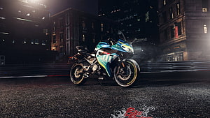 CFMoto 300SR Sport Bike in Teal and White Livery Parked on a Dark City Street at Night HD wallpaper