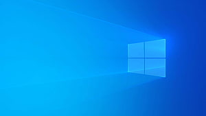 Windows 10 Default Blue Background with Glowing Four-Pane Logo and Light Rays HD wallpaper