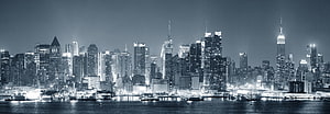 New York City Manhattan Skyline at Night with Waterfront Reflections HD wallpaper