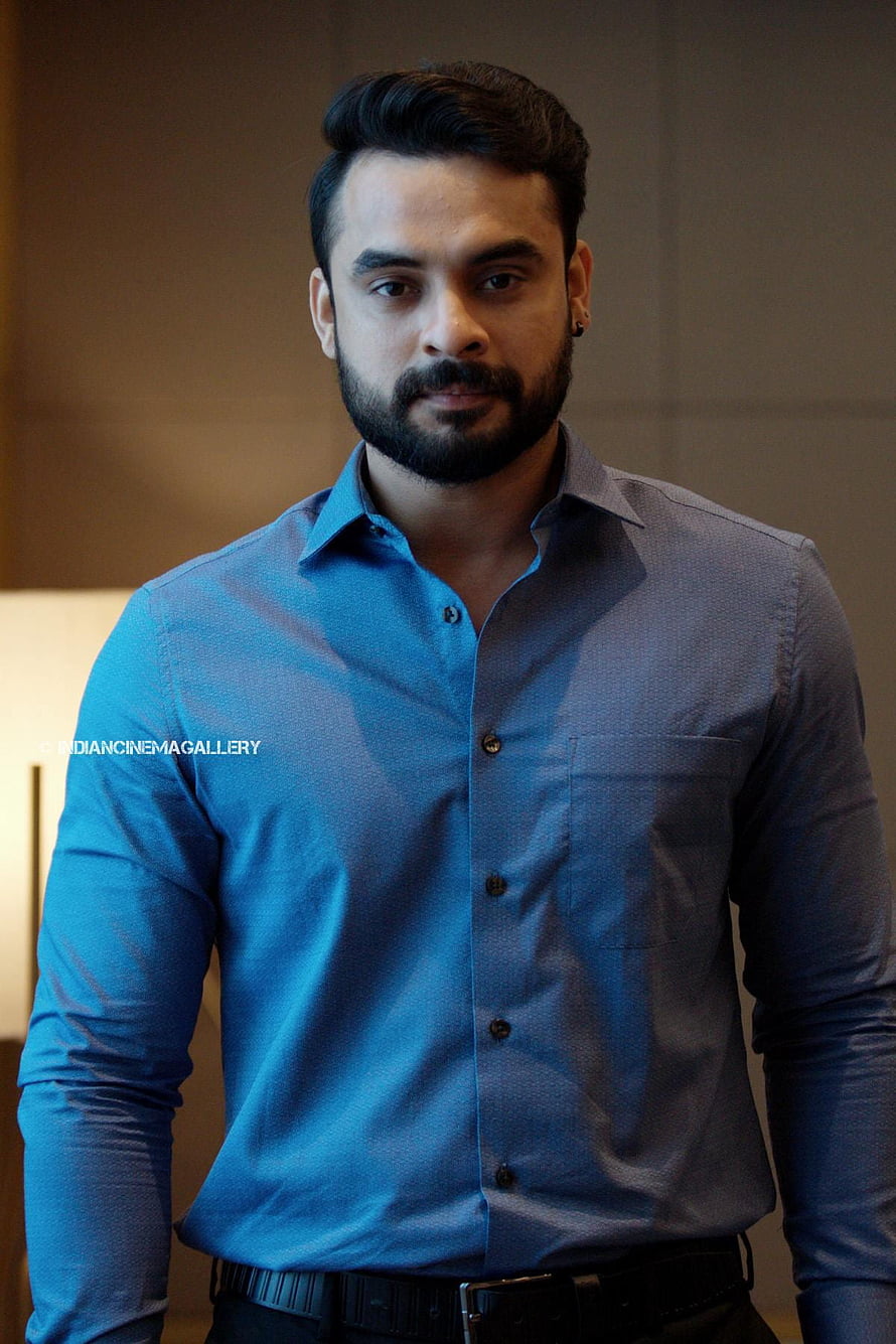 Tovino Thomas in a blue button-down shirt with a full beard and styled hair HD phone wallpaper