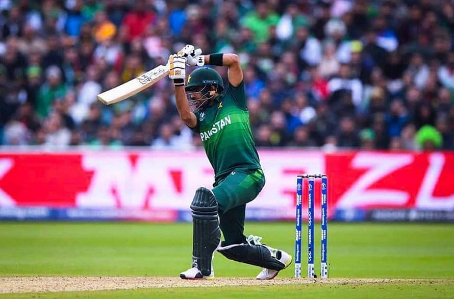 Babar Azam in Pakistan green kit playing a cricket shot at the stumps HD wallpaper