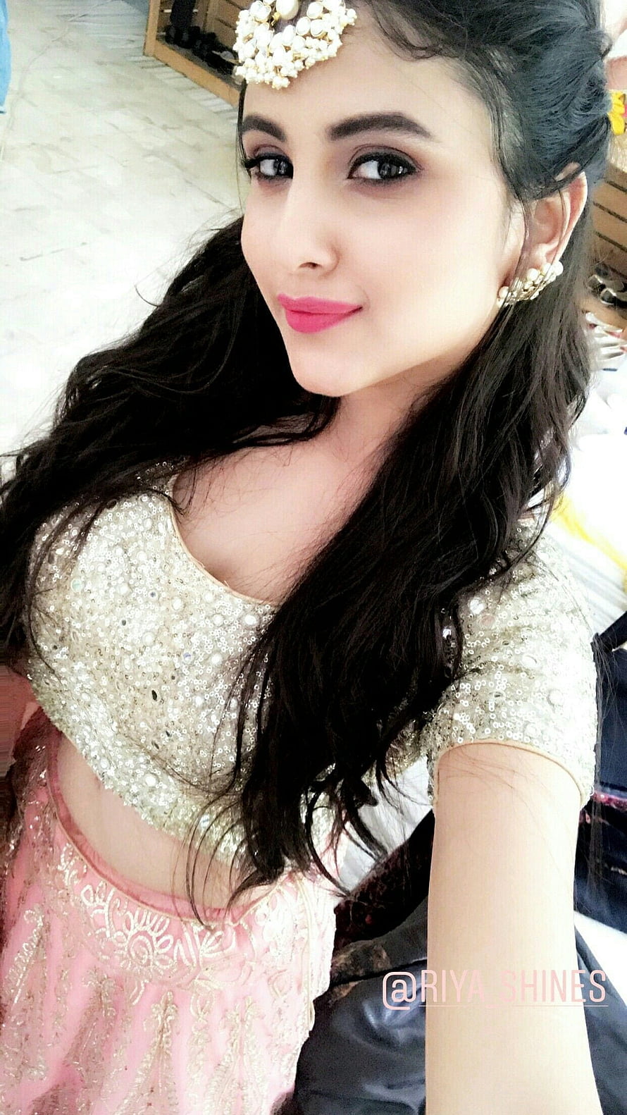 Elegant Indian Woman in Sequined Blouse and Pink Lehenga with Pearl Headpiece HD phone wallpaper