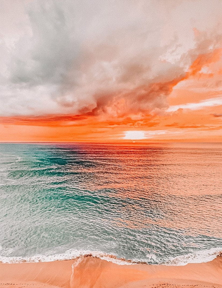 Vibrant Ocean Sunset Over Sandy Shore With Dramatic Clouds HD phone wallpaper