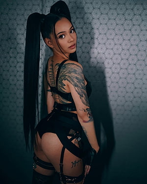 Bella Poarch in Black Harness Outfit with High Ponytail and Feather Sleeve Tattoo HD phone wallpaper