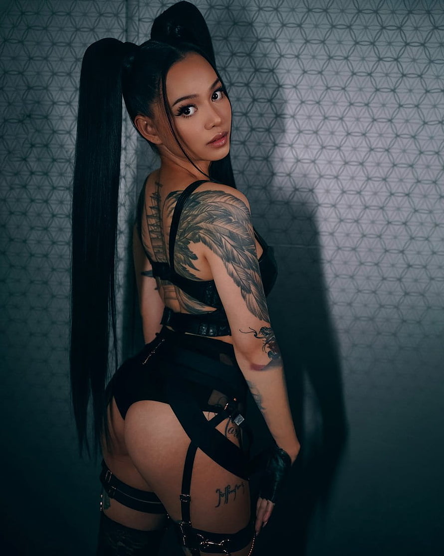 Bella Poarch in Black Harness Outfit with High Ponytail and Feather Sleeve Tattoo HD phone wallpaper