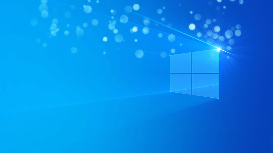 Windows 11 Default Blue Desktop Background with Glowing Window Logo and Bokeh Light Particles HD wallpaper