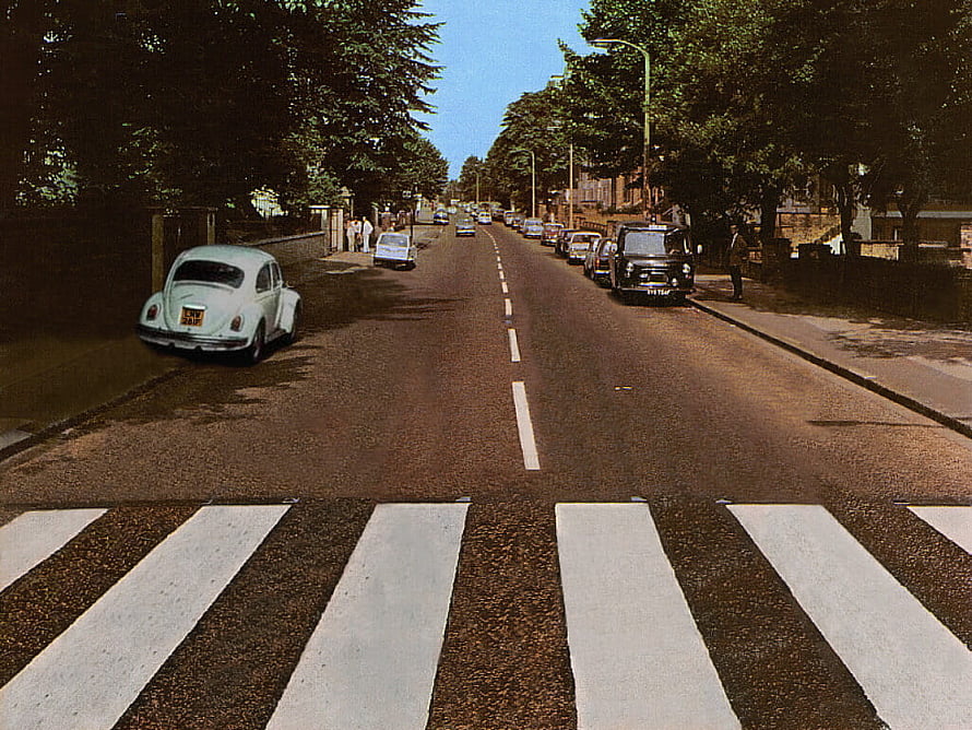 Abbey Road Crosswalk with Vintage Cars and Lush Green Trees HD wallpaper