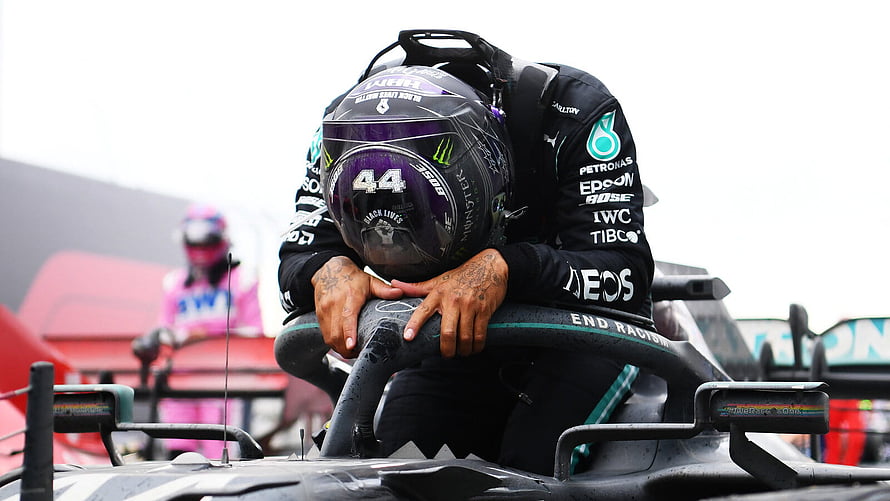 Lewis Hamilton in Mercedes F1 Helmet Leaning on Car During Race HD wallpaper