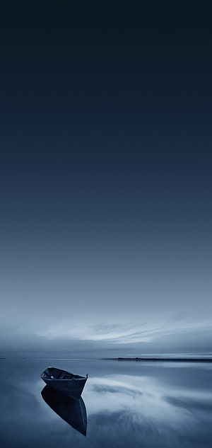 Solitary Rowing Boat on Calm Water at Blue Hour with Perfect Reflection HD phone wallpaper