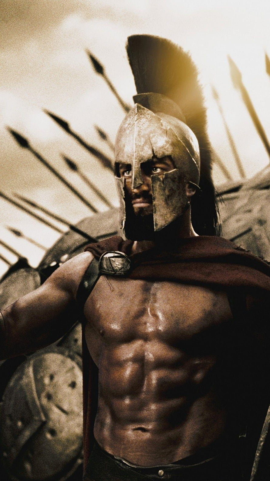 Spartan Warrior in Bronze Helmet and Crimson Cloak Amidst Phalanx Formation HD phone wallpaper