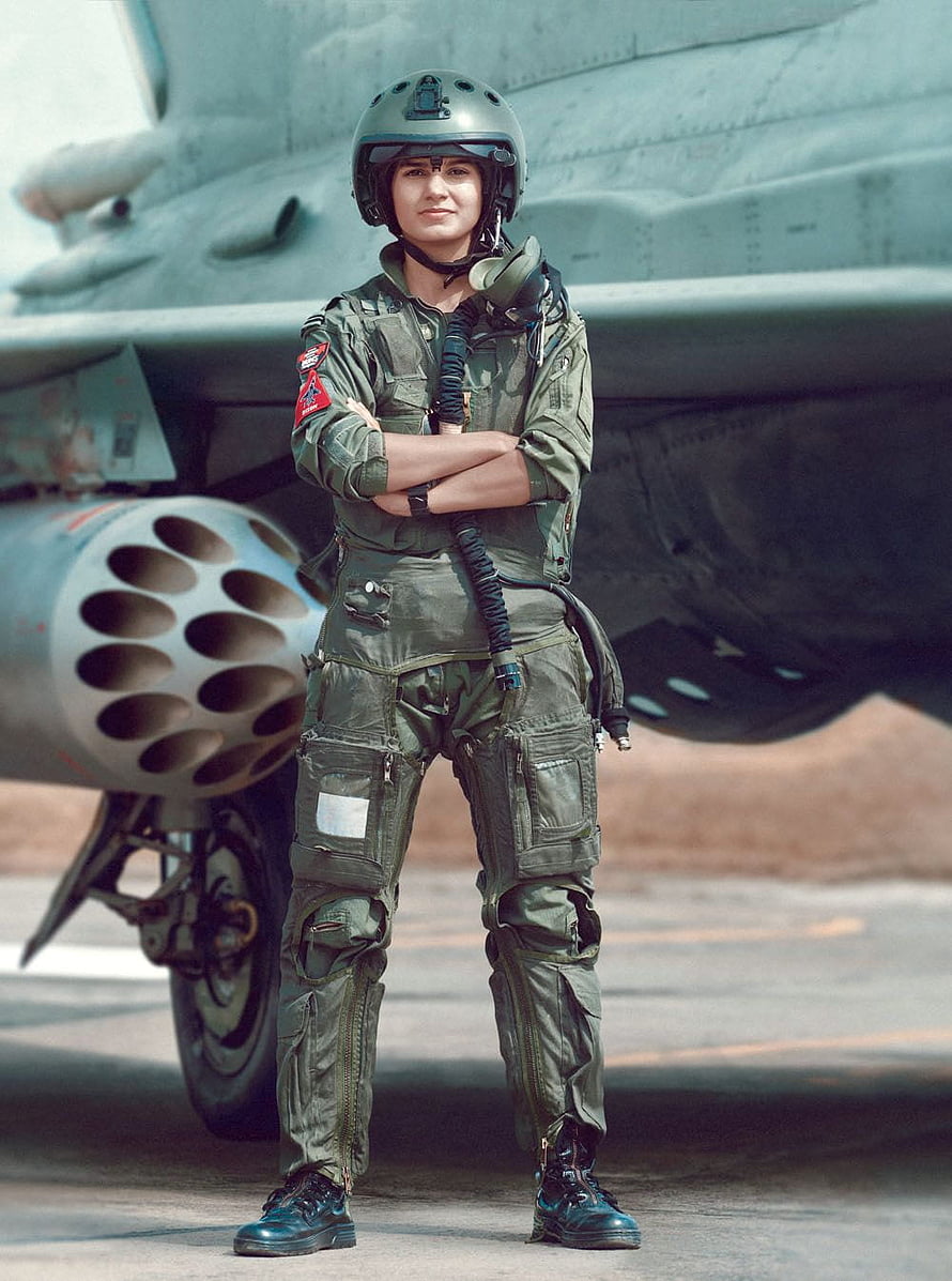 Indian Air Force female fighter pilot in flight suit standing in front of a military jet HD phone wallpaper