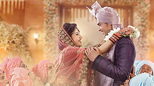 Traditional Indian Wedding Couple Sharing a Joyful Moment in Ornate Attire HD wallpaper