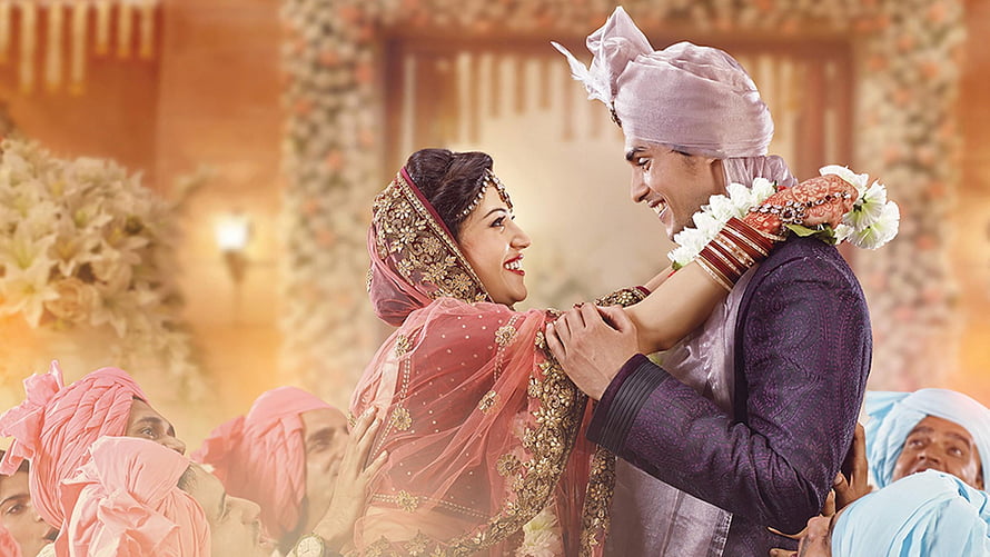 Traditional Indian Wedding Couple Sharing a Joyful Moment in Ornate Attire HD wallpaper