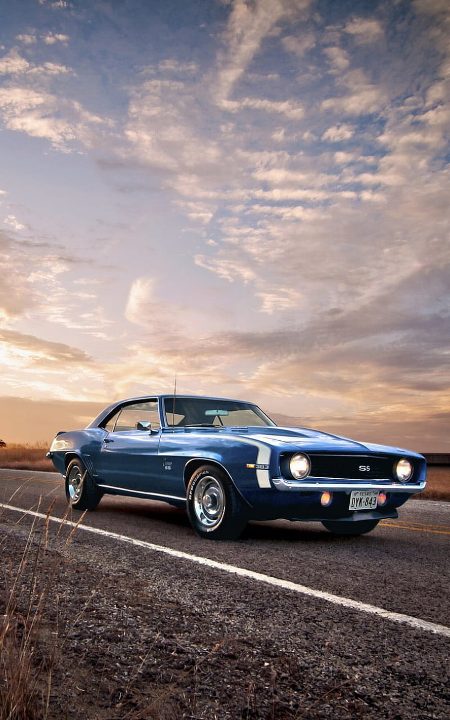 Classic Blue Chevrolet Camaro SS Muscle Car on Open Road at Sunset HD phone wallpaper