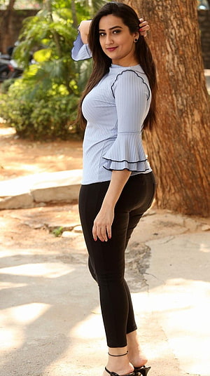 Manjusha in Light Blue Ruffled Top and Black Leggings Outdoors HD phone wallpaper