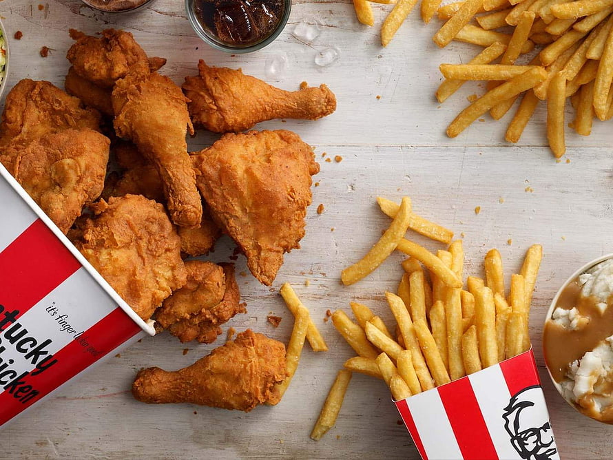 KFC Fried Chicken and French Fries with Dipping Sauces on Rustic Wooden Table HD wallpaper