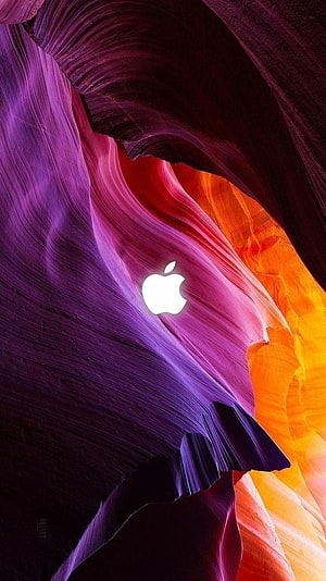 Apple Logo on Vibrant Purple and Orange Slot Canyon Rock Formations HD phone wallpaper