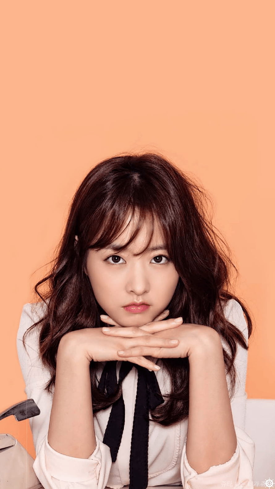 Park Bo Young Portrait in White Blouse with Black Ribbon Against Warm Orange Background HD phone wallpaper