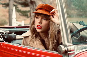 Taylor Swift in Vintage Red Convertible with Rust Hat and Bold Red Lipstick HD wallpaper