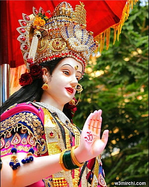 Mata Rani Deity Statue in Ornate Gold Crown and Traditional Indian Attire HD phone wallpaper