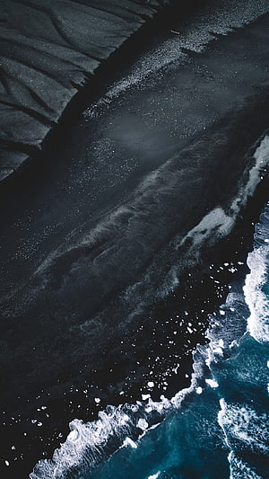 Aerial View of Black Sand Beach with Turquoise Waves and Ice HD phone wallpaper