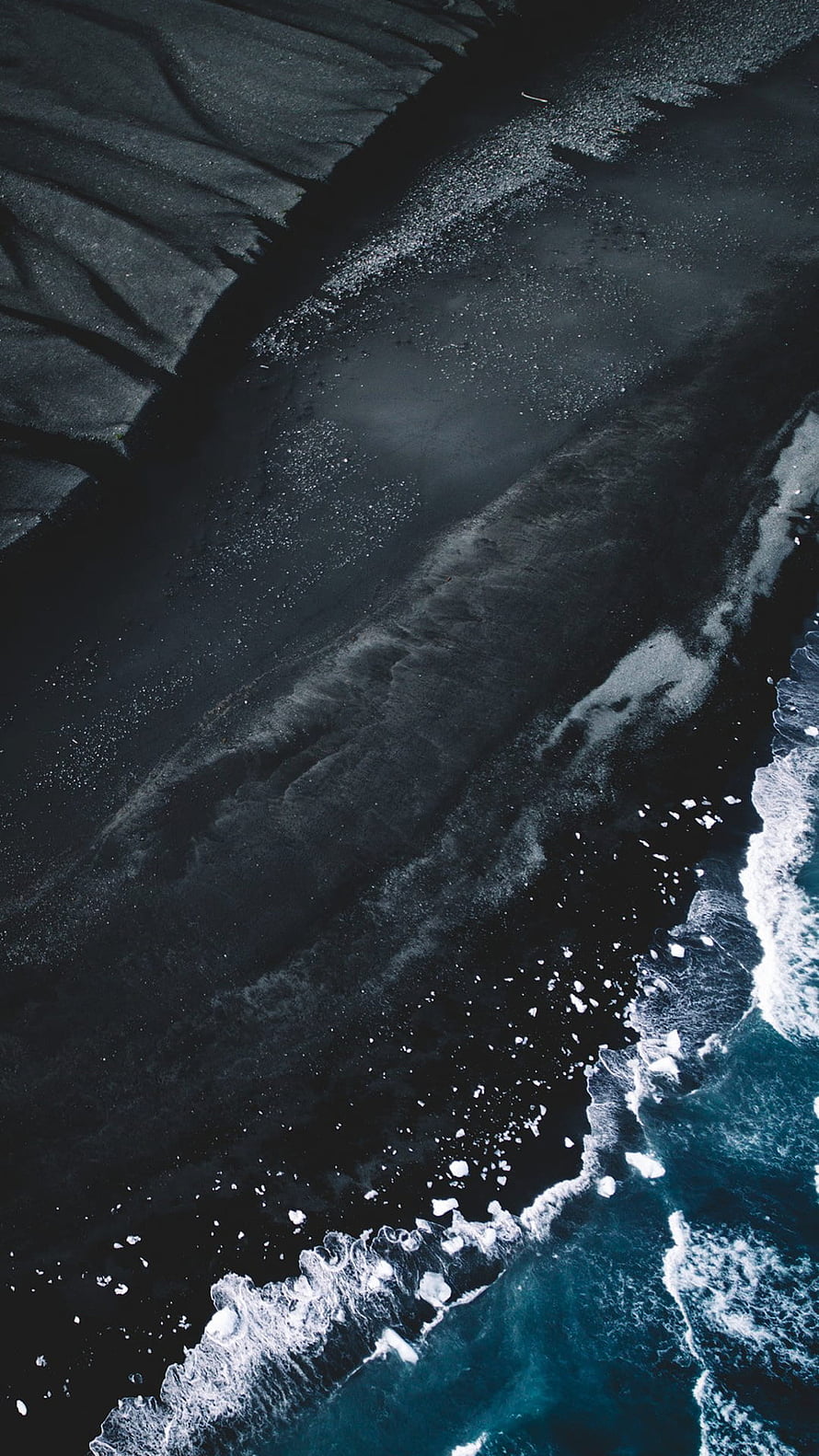 Aerial View of Black Sand Beach with Turquoise Waves and Ice HD phone wallpaper