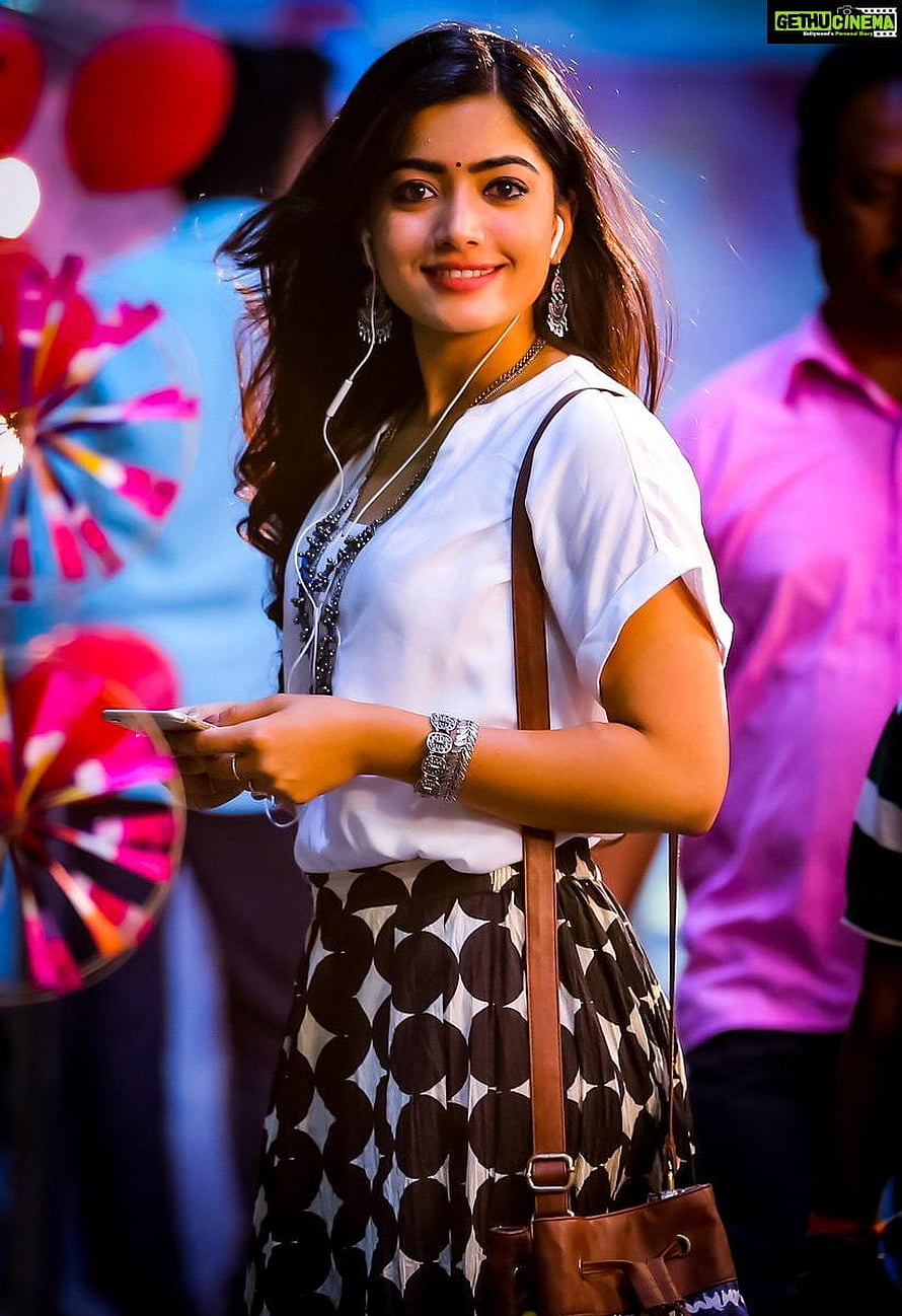 Rashmika Mandanna in White Top and Patterned Skirt at a Vibrant Event HD phone wallpaper