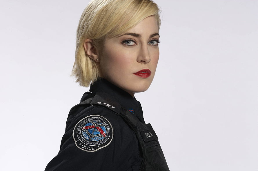 Charlotte Sullivan as a Metacortican Law Enforcement Officer in a Dark Police Uniform HD wallpaper